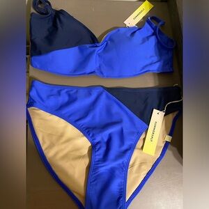 Sunmersalt two piece swimsuit in Deep Sea and Hydrangea.